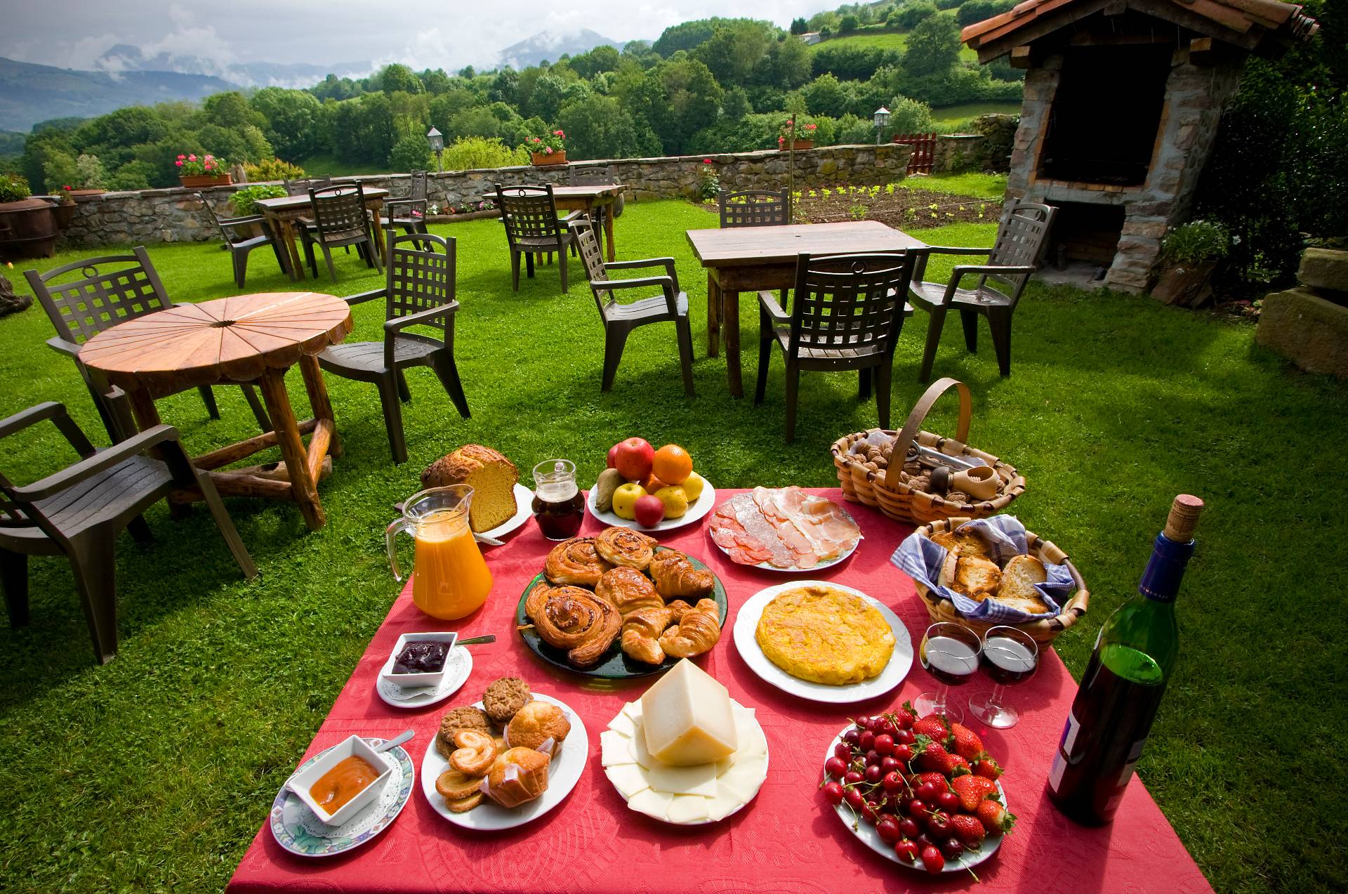 Table in the garden prepared for breakfast in Baztan