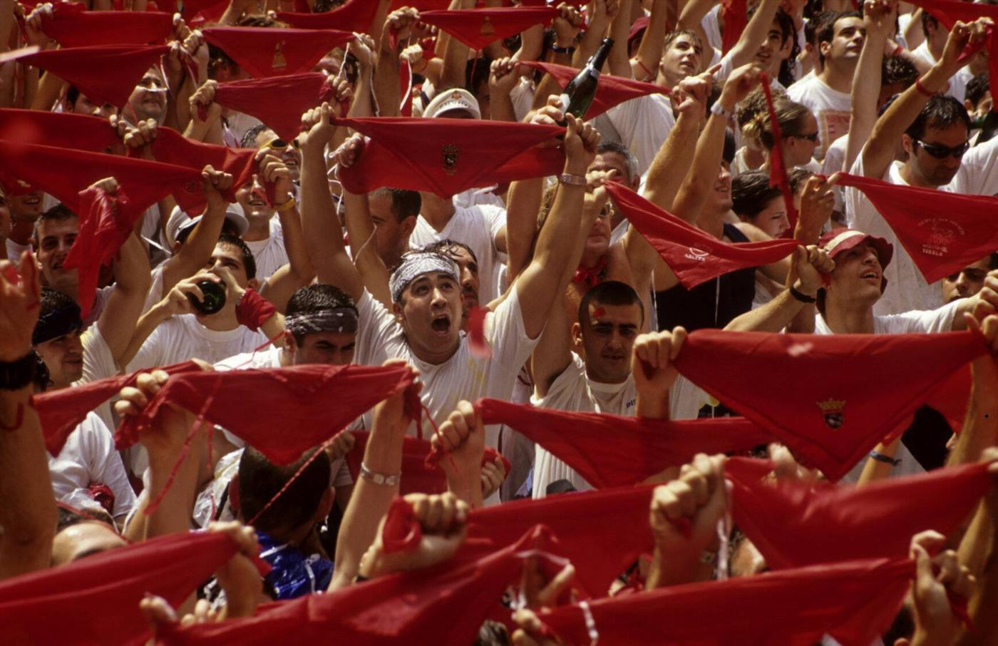 Red handkerchiefs up waiting for the chupinazo