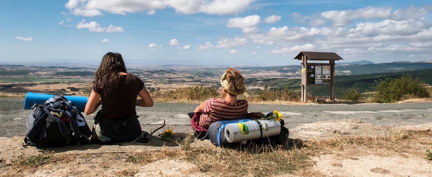 Two pilgrims resting on the road